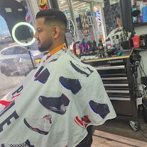 Client getting a fresh cut in the barber chair